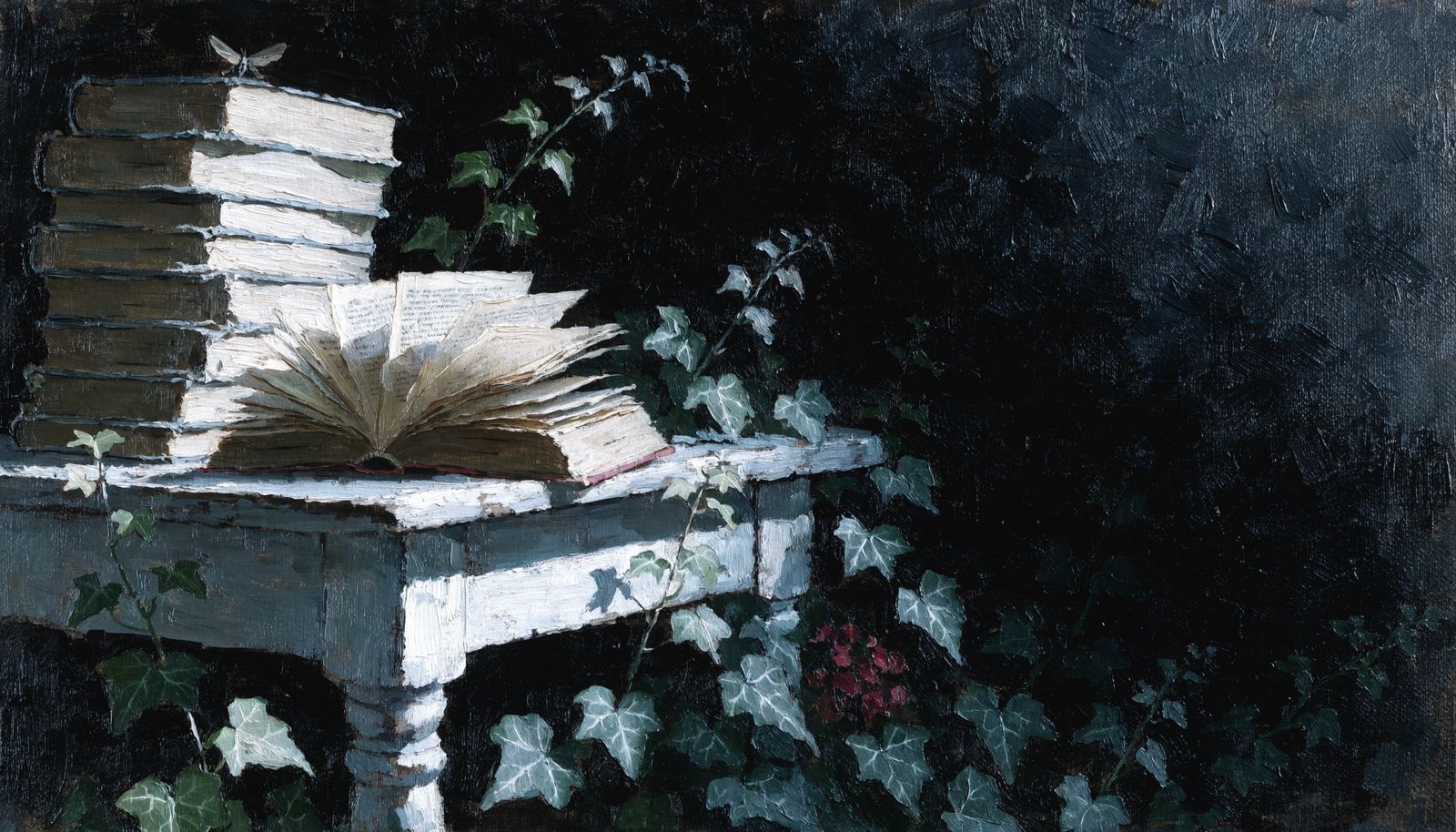 A stack of old books on a garden table with ivy and a moth